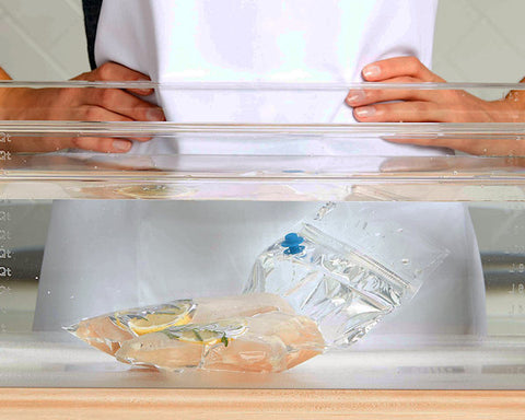 https://savoursousvide.com/cdn/shop/files/Sealed-Savour-Sous-Vide-Cooking-Bag-with-chicken-swimming-in-water-bath_large.jpg?v=1613707452